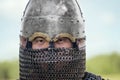 Close up face of asian warrior in eastern medieval helmet. Royalty Free Stock Photo