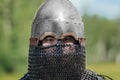 Close up face of asian warrior in eastern medieval helmet. Royalty Free Stock Photo
