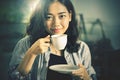 Close up face of asian woman with hot coffee cup ready to drink Royalty Free Stock Photo