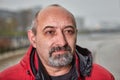 Close-up face of a bearded balding man over 50