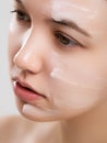 Close up of the face of a beautiful girl with perfect skin and clean all impurities thanks to moisturizing Royalty Free Stock Photo