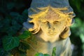 Close up face of beautiful guardian angel. Fragment of an antique statue