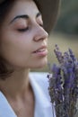 Close up face of beautiful woman in hat with flowers Royalty Free Stock Photo