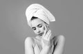 Close up face of beautiful young woman with bath towel on head. Beautiful woman face isolated on studio. Natural Royalty Free Stock Photo