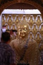 Close up face of buddha sculpture in temple