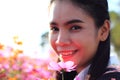 Close up face,caucasian woman and expression happiness,pretty girl with pink cosmos flowers Royalty Free Stock Photo