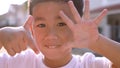 Close up face of cheerful asian children hand playing of number one to ten