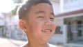Close up face of cheerful asian children happiness emotion standing outdoor