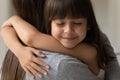 Close up face of daughter cuddle her mother heartfelt moment Royalty Free Stock Photo