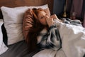 Close-up face of desperate woman crying lying alone on bed under blanket, have depression and stress, looking hopelessly Royalty Free Stock Photo