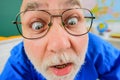 Close up face funny teacher in glasses. Male teacher or professor in school classroom. Learning and education. Human Royalty Free Stock Photo