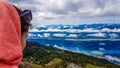 Austria - Girl wearing a hoodie admiring the view on Lake