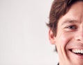 Close Up On Face Of Laughing Man Standing In Studio Royalty Free Stock Photo
