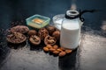 Close up of face mask or face pack of walnut along with flax seed or alsi, almonds,yogurt and milk in a glass bowl   entire raw in Royalty Free Stock Photo