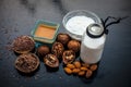 Close up of face mask or face pack of walnut along with flax seed or alsi, almonds,yogurt and milk in a glass bowl   entire raw in Royalty Free Stock Photo