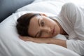 Closeup melancholic 30s woman awakened lying in bed feels depressed