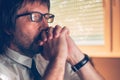 Close up face portrait of concentrated businessman thinking