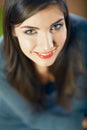 Close up face portrait of toothy smiling young woman looking up Royalty Free Stock Photo