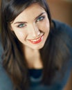 Close up face portrait of toothy smiling young woman looking up Royalty Free Stock Photo