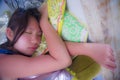 Close up face portrait of young and beautiful Asian Chinese girl sleeping peacefully and tranquil taking a nap resting tired
