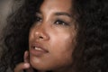 Close up face portrait of young beautiful and exotic mixed ethnicity latin and afro American woman with expressive eyes in beauty