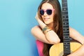 Close up face portrait of young woman with guitar Royalty Free Stock Photo