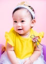Close up face princess little baby girl in beautiful dress she is smile in studio Royalty Free Stock Photo