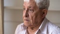 Close up face of sad senior man feels lonely Royalty Free Stock Photo