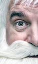 Close-up of the face of a surprized Santa Claus