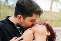 Close-up of the face of two lovers kissing. concept of love, romanticism, affection, youth and valentine Royalty Free Stock Photo