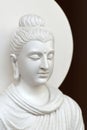 Close-up face of a white stone Buddha image Royalty Free Stock Photo