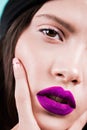 Close up face of a woman with professional make up, purple lips, detail. Fashion. Beauty portrait Royalty Free Stock Photo