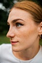 Close-up face of a young ginger ginger freckled woman with red hair and perfect healthy freckled skin Royalty Free Stock Photo