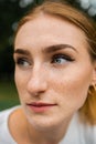 Close-up face of a young ginger ginger freckled woman with red hair and perfect healthy freckled skin Royalty Free Stock Photo