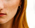 Close-up face of a young ginger ginger freckled woman with red hair and perfect healthy freckled skin Royalty Free Stock Photo