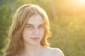 Close up face of young stylish woman. Beautiful fashionable girl outdoor portrait. Soft sunny sunlight on sunny autumn Royalty Free Stock Photo