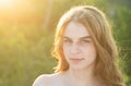 Close up face of young stylish woman. Beautiful fashionable girl outdoor portrait. Soft sunny sunlight on sunny autumn Royalty Free Stock Photo