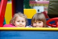 Close up of faces of two happy playful girls