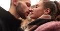 Close-up of the faces of a young couple in love kissing and hugging on the street Royalty Free Stock Photo