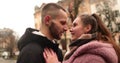 Close-up of the faces of a young couple in love kissing and hugging on the street Royalty Free Stock Photo