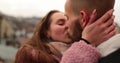 Close-up of the faces of a young couple in love kissing and hugging on the street Royalty Free Stock Photo