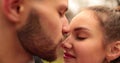 Close-up of the faces of a young couple in love kissing and hugging on the street Royalty Free Stock Photo