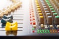 Close up Faders of sound mixer Volume adjusting knobs controller in control room Royalty Free Stock Photo