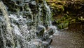 Closeup of falling and splashing streams of water, Ivande waterfall, Latvia Royalty Free Stock Photo