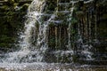 Closeup of falling and splashing streams of water, Ivande waterfall, Latvia Royalty Free Stock Photo