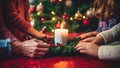 Close-up of family decorating christmas tree together at home Royalty Free Stock Photo