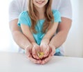 Close up of family hands holding euro money coins Royalty Free Stock Photo