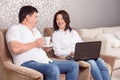 Close-up of family reading book and drinking tea Royalty Free Stock Photo