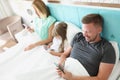 Family stare in smartphone, morning in bed with devices, kill time