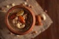 Close up of a famous Bengali dessert `Nolen Gurer Chanar Payesh` or Milk pudding of cottage cheese in an earthen pot